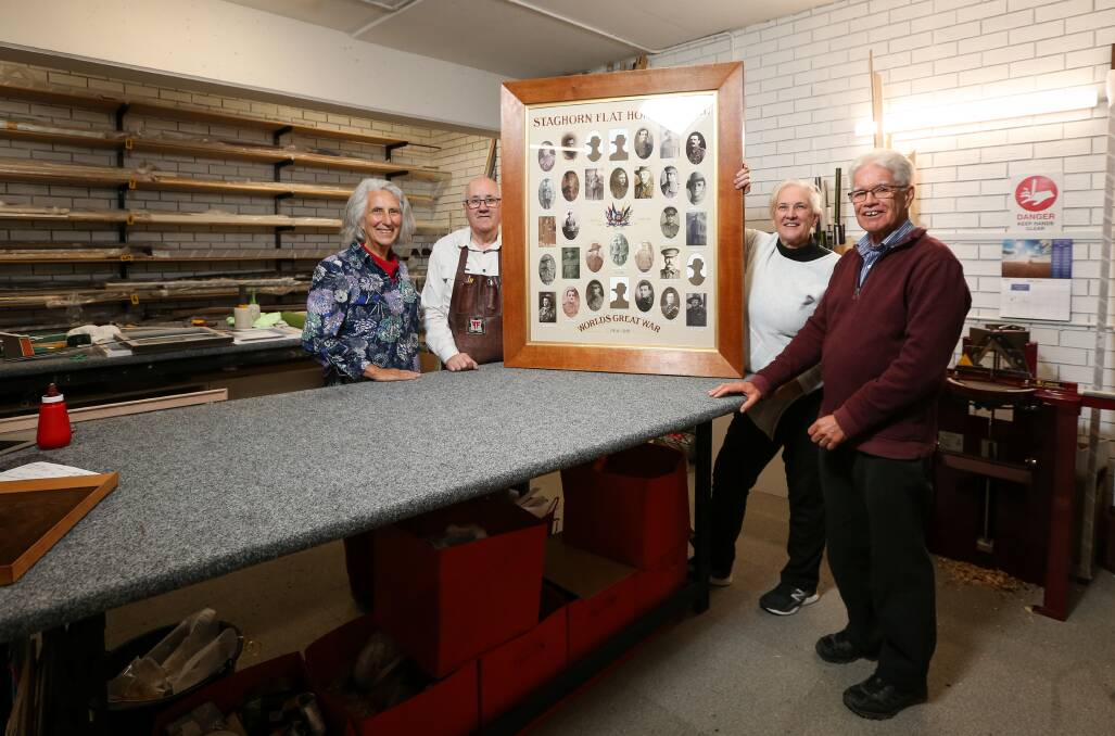 COMPLETE: Thelma Buchanan, Roger Coulston, Jac Recsei and Ian Touzel have all contributed to the recreation of the Staghorn Flat School WWI honour board. It was done at Finer Frames and Gallery Wodonga. Picture: JAMES WILTSHIRE