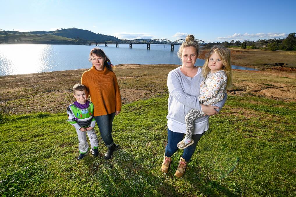 PASSAGE: Bellbridge residents including Atticus Hamam, 4, mum Gennifer Hamam and Loren Dolphin and Ivy Vicary, 3, are glad to be able to cross the Bethanga Bridge, after concern it would be a checkpoint. Picture: MARK JESSER