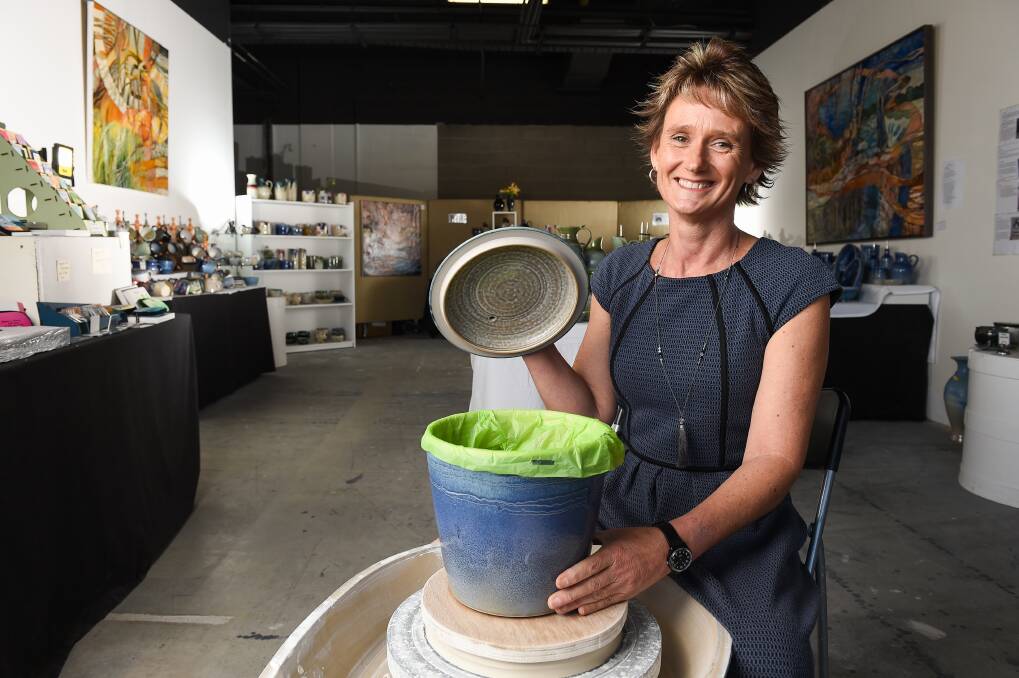 ALTERNATIVE: Potter Kerrie Docker is selling ceramic green waste bins at her AMP Lane pop-up shop near Target in Albury. Picture: MARK JESSER