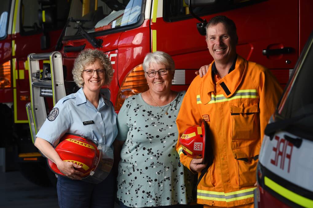 REFLECT: Chiltern fire brigade captain Marelle Whitaker and of the Carlyle Brigade Diane Chant and captain Wayne Vincent, are celebrating the role of women in the CFA and the growth of the Carlyle group. Picture: MARK JESSER