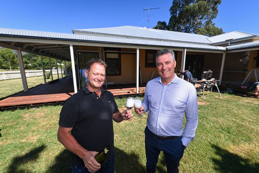 New tourism accommodation is close to completion at Dal Zotto Wines, which chief executive Michael Dal Zotto and Wangaratta mayor Dean Rees hope will entice visitors. Pictures: MARK JESSER