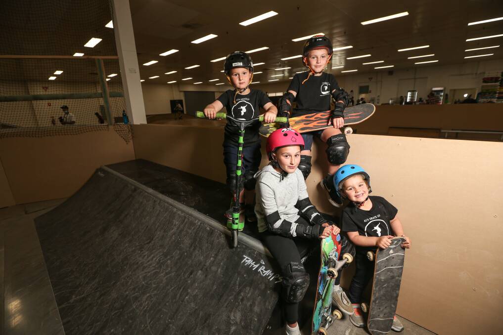 STOKED: The Toll kids - Seth, 5, Tilly, 10, Memphis, 9, and Chevy, 4, were testing out the ramps at Al's Skate Co's grand opening on Melbourne Road. Picture: JAMES WILTSHIRE 