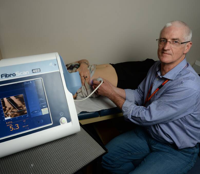 HOPE: Albury Community Health hepatitis C nurse Geoff Bartlett, using the Fibroscan to detect liver health. The machine, funded for two years through NSW health, is the first between Melbourne and Albury. Picture: MARK JESSER