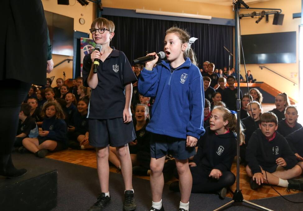 LEADING: Yarrawonga Sacred Heart year 5 students Rory Carlin, and Darla Lawless, both 10, were solo singers. Picture: JAMES WILTSHIRE