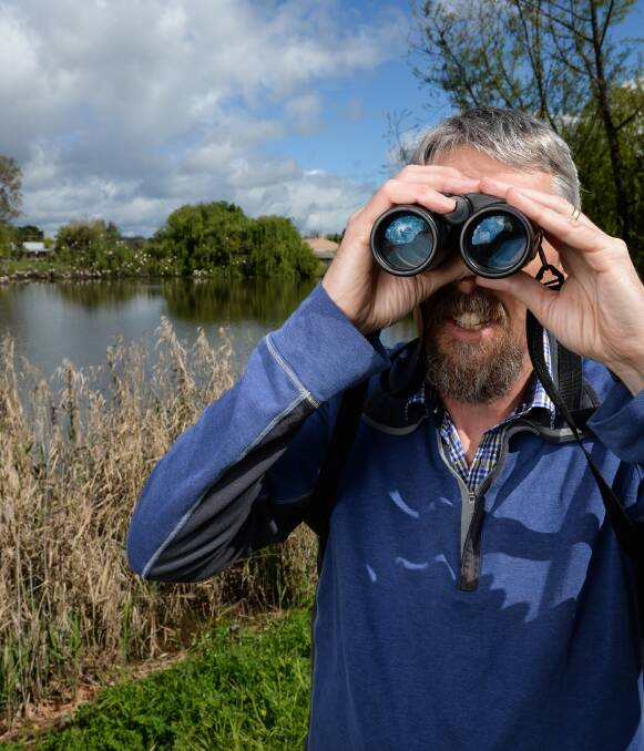 WATCHING: Peter Ewin on the lookout at an ibis breeding ground in at Fromholtz Park in South Albury for the national Aussie Back Yard Bird Count. He is encouraging Border residents to get the app and take part. Picture: MARK JESSER