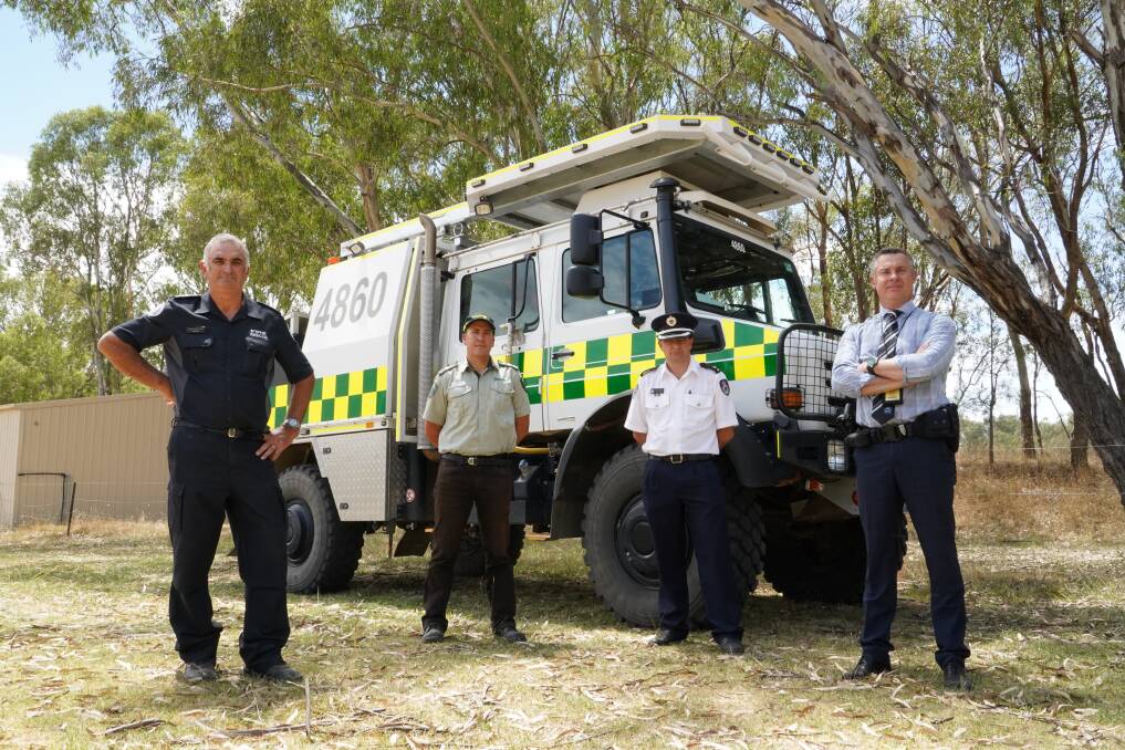 ON ALERT: CFA's Paul King, FFMVic Hume deputy chief fire officer Aaron Kennedy, RFS Superintendent Pat Westwood and Detective Sergeant Graeme Simpfendorfer are urging residents to help them reduce fire risk this weekend. Picture: DELWP