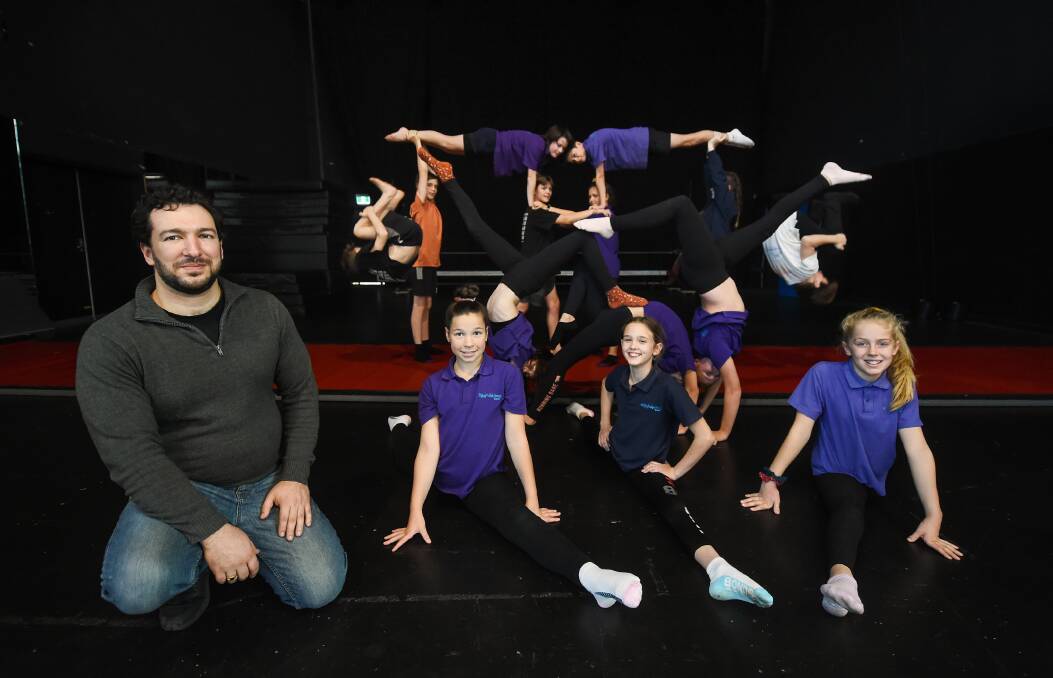 RETURN: Flying Fruit Fly Circus training director Loic Marques has led Foundation Group students including Milanni Klippel, 11, Aysha Witt, 12 and Araluen Vonthien, 11, through learning during COVID-19. Picture: MARK JESSER