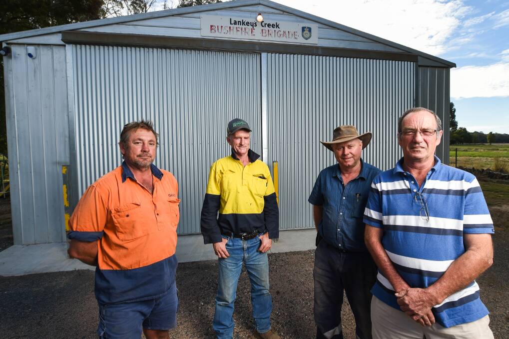 REFLECTING: Jason McBain, Jed Taylor, John Hawkins and Richard Harbison discussed recent fire efforts with Greater Hume Shire in Lankeys Creek. Picture: MARK JESSER