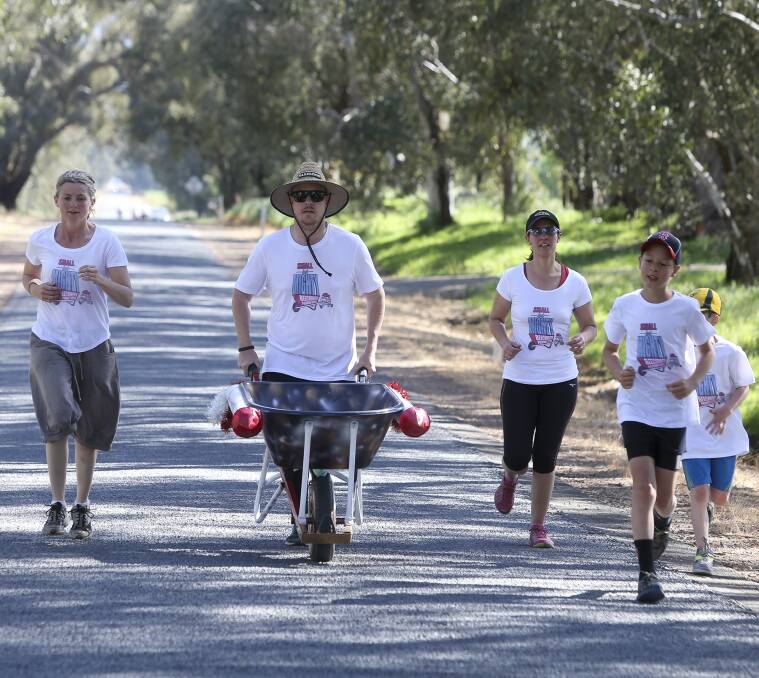 UP TO TASK: The Beechworth Primary School team along Bowmans Road. Picture: ELENOR TEDENBORG
