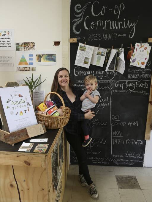 STAND-OUT: Board member Narelle Edwards with daughter, Scout Gallagher, 2, at the Beechworth Food Co-op, which took out a Tidy Towns award. Picture: ELENOR TEDENBORG