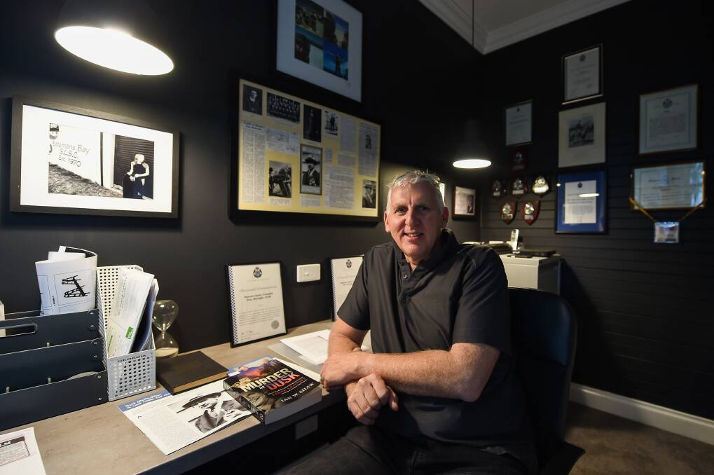 Sergeant Peter McGuffie in his office at his Wangaratta home, which features clippings of his great uncle. Pictures: MARK JESSER