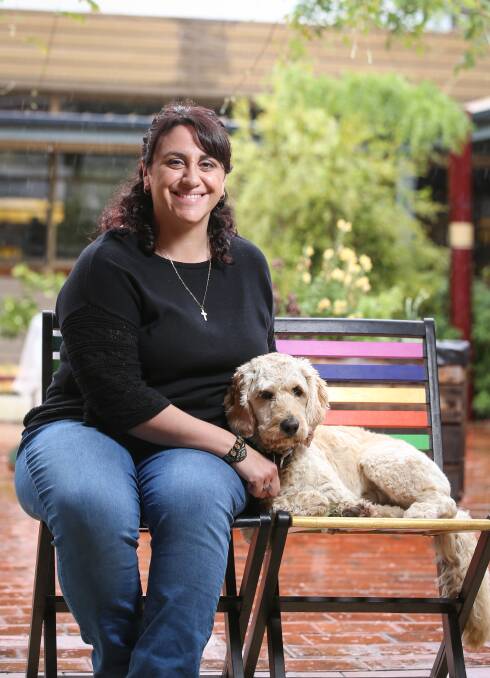 SUPPORT: Lawyer Andrea Georgiou, pictured with therapy dog Lexi, spends Tuesdays at a centre in Wodonga for kids disengaging from school. Picture: JAMES WILTSHIRE