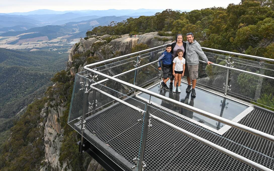 WAY UP: Sonia Gorgioski with husband Bobby, Christian, 10, and Makayla, 8, enjoying the new lookout on Thursday. Picture: MARK JESSER