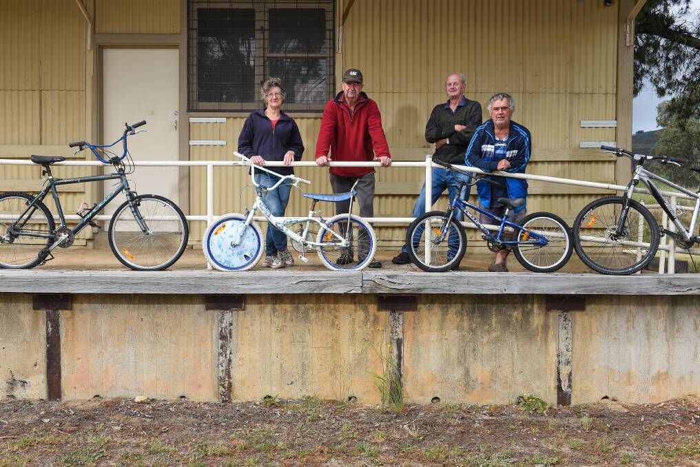 LONG-STANDING: Louise Coulston, Jim Scott, Phil Coulston and Arthur Trenchard are members of the Tallangatta Rail Trail Advisory Group, which has met at the former goods shed since 2002. Picture: MARK JESSER