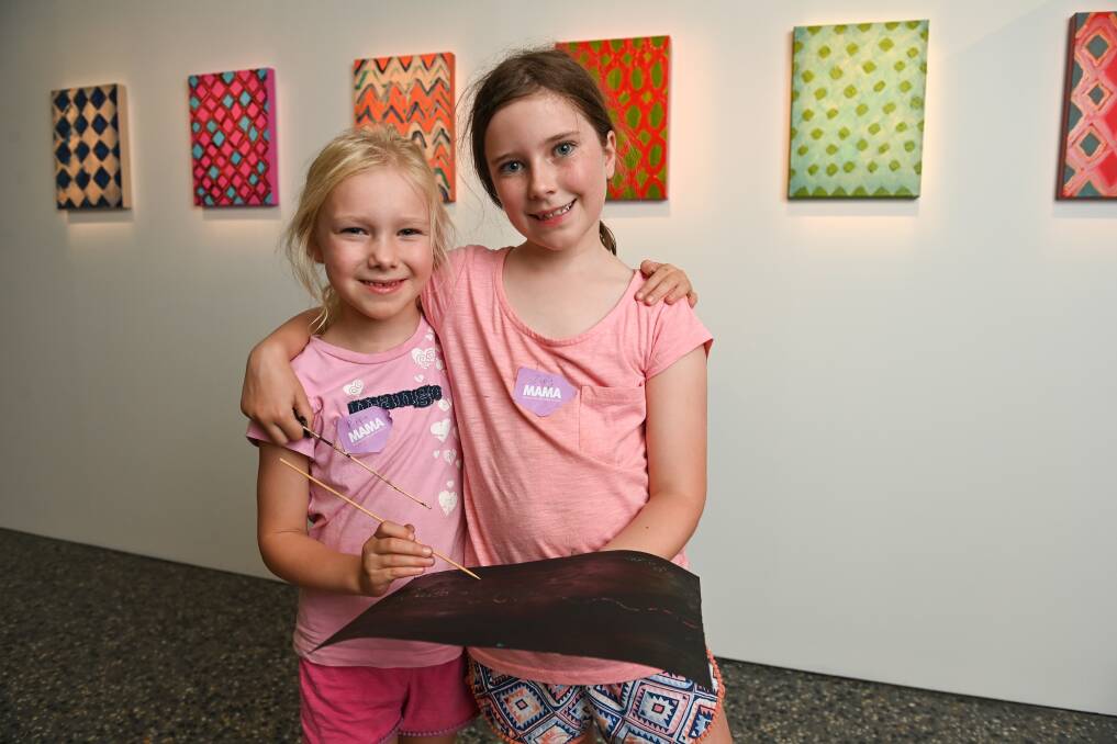 OUR TAKE: Lavington sisters Pippa, 6, and Zoey Taylor, 8, went to art camp at the Murray Art Museum Albury, which is fully booked for the January period. Their activity focused on Mary Jane Griggs' paintings. Picture: MARK JESSER