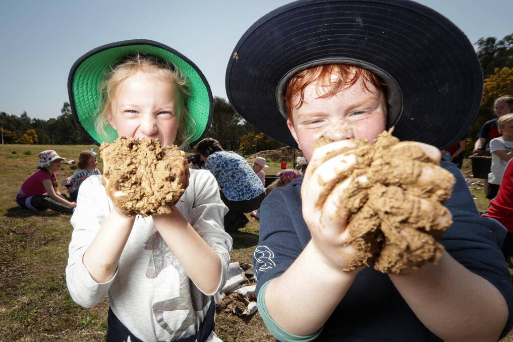 Remi James, 6 and Euan Sidgwick, 6, make mud bricks at Trinity Anglican College. Picture: JAMES WILTSHIRE