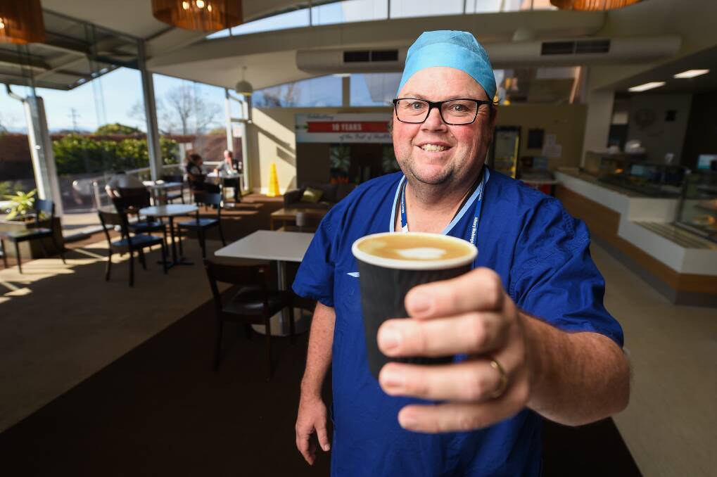 GESTURE: Albury Wodonga Health employees like Damien Shanahan have enjoyed free coffee thanks to Vitasoy, which has its plant at Baranduda. Picture: MARK JESSER