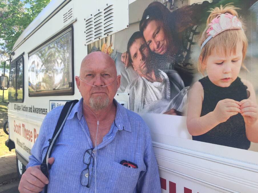 SPEAKING OUT: Russell Stedman is touring Victoria to raise awareness of Alpha-1, in a van bearing slogans and photos of people who share the condition he inherited.
