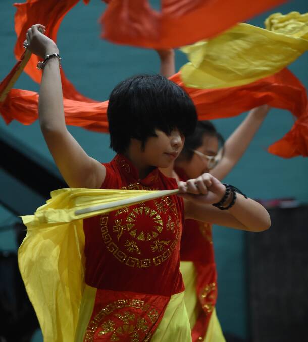 CULTURAL: Vietnamese exchange student An Khanh, 15, performs with a group to thank Wodonga Senior Secondary College for hosting them. Picture: MARK JESSER