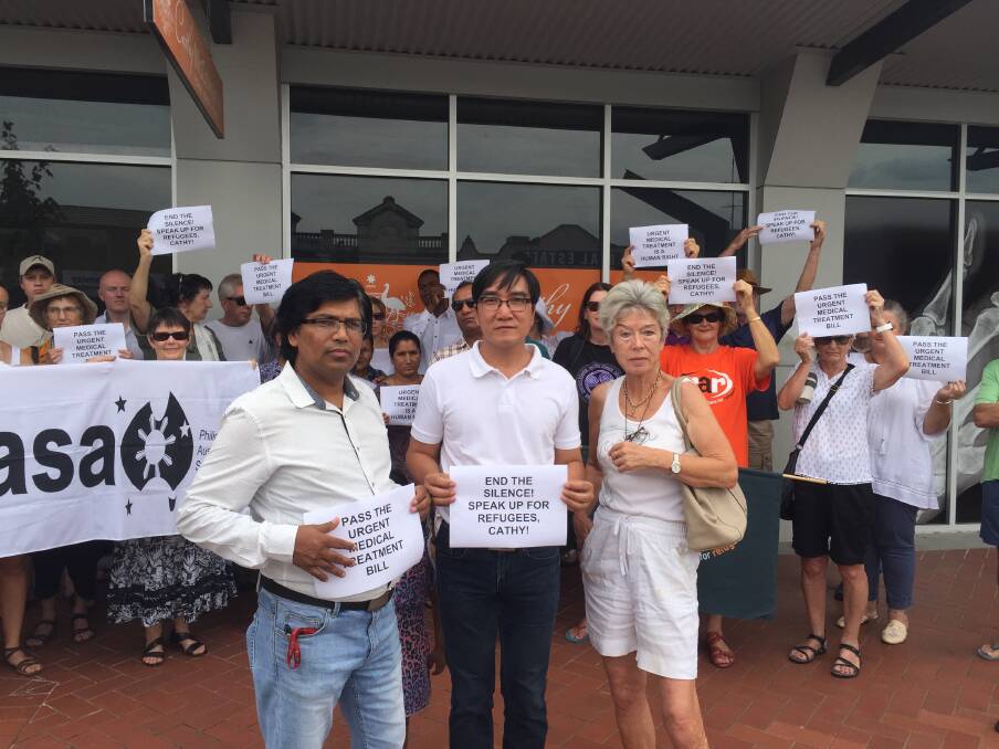 AWECC's Teju Chouhan, Pastor Berlin Guerrero and Albury-Wodonga RAR secretary Dorothy Simmons led the protest outside Cathy McGowan's office in Wodonga.
