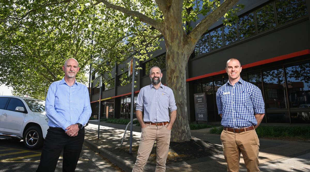 TOUCH BASE: Psychologist Richard Brown encourages other businesses to take part in a mental health survey being led by Personnel Group's James Smith and Carrick Gill-Vallance of ANCC. Picture: MARK JESSER