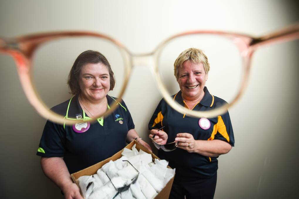 BRIGHT-EYED: Wangaratta and Beechworth Lions Club members Alison Kazenwadel and Josie Cornish promoting the Recycle for Sight program. Picture: MARK JESSER