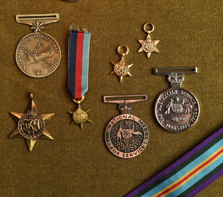 RARE SKILL: Mr Johnston has been making service medals for 69 years and counting. Picture: MARK JESSER