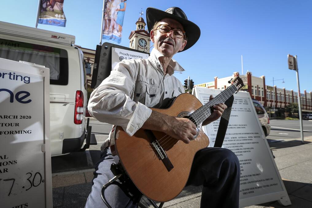SPREAD THE WORD: Murray Mandel, a former hospital microbiologist from Sydney, is raising monery for Lifeline playing classical guitar on the streets around Australia over the next three years. Picture: JAMES WILTSHIRE