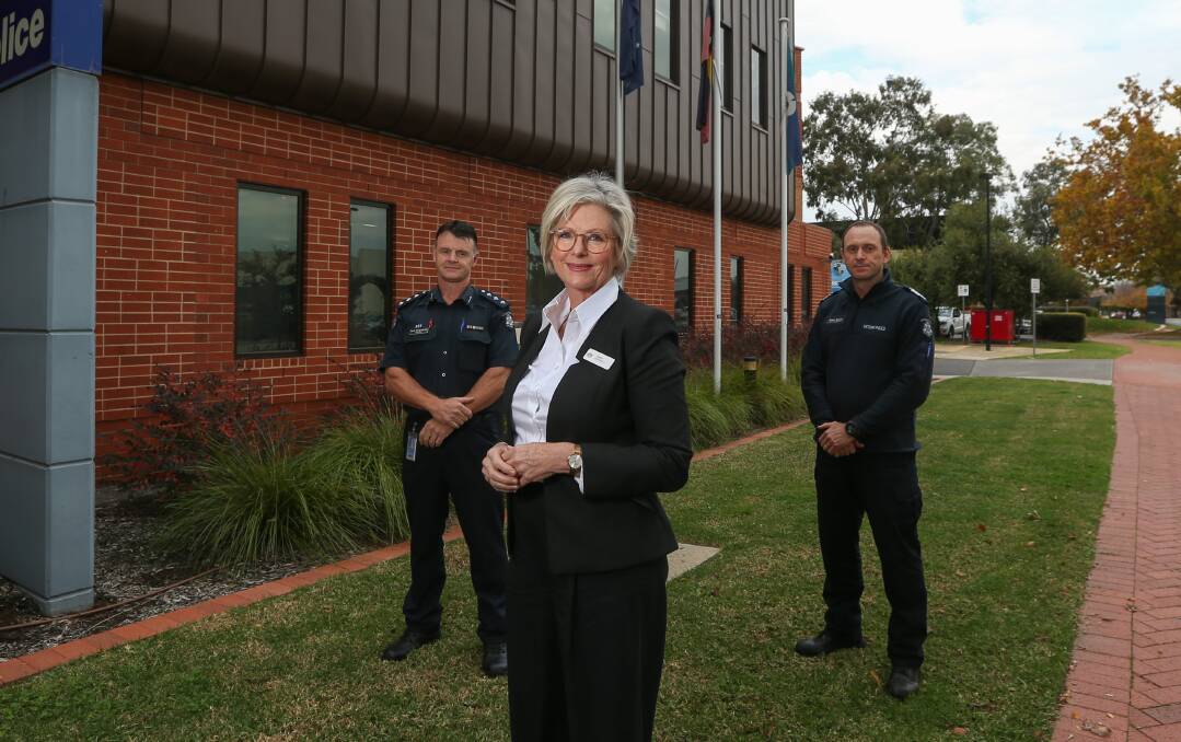 REFRESH: Indi MP Helen Haines provided new flags to Wodonga police's Paul Hargreaves and Shane Martin. Picture: TARA TREWHELLA