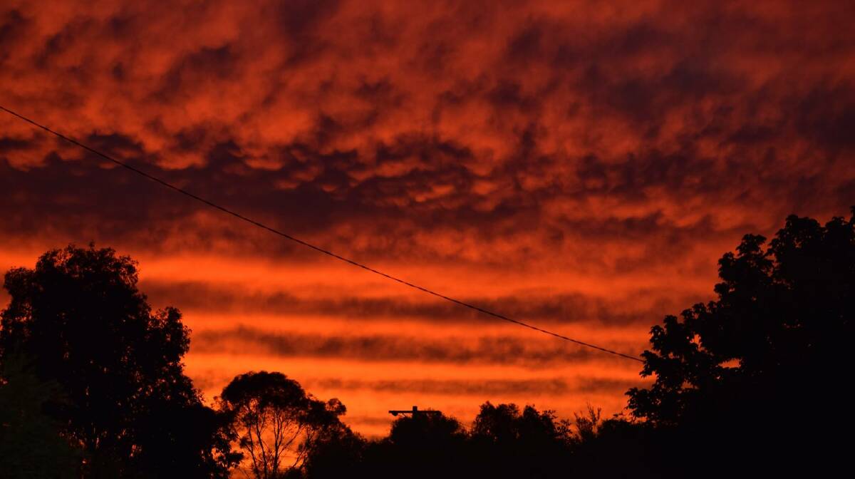 SKIES ALIVE: Monday's spectacular sunset, pictured here at Chiltern, was caused by a phenomenon that occurs due to smoke particles in the air. Picture: KURTIS HICKLING