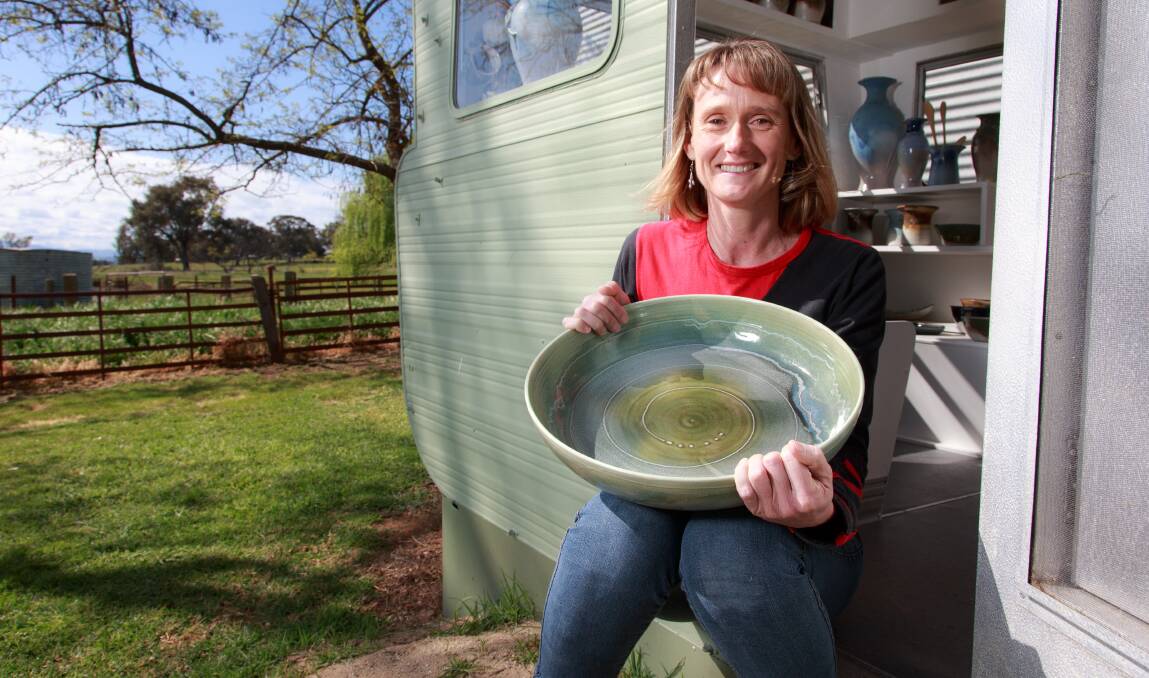 NEW: Docker, who has practised pottery for 30 years, is officially opening her new shop, fitted out in an old caravan over the past two years.