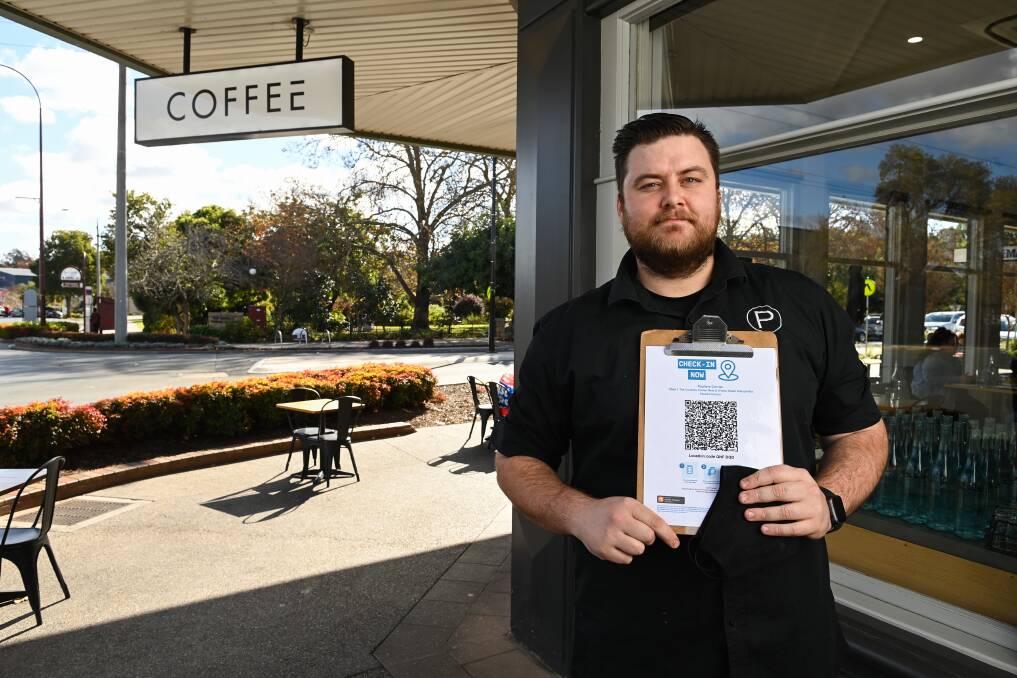 SCAN IT: Whether you're coming in for a takeaway or sitting in, you'll need to check-in at cafes like Paulie's Corner Cafe in Wangaratta owned by Paul Szeligiewicz. Picture: MARK JESSER