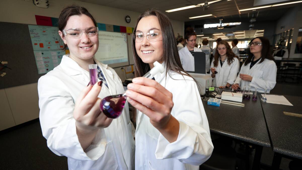 CHEMISTS: Wangaratta High School students Rose Irving, 16, and Elizabeth George, 17, take part in the roadshow. Picture: JAMES WILTSHIRE