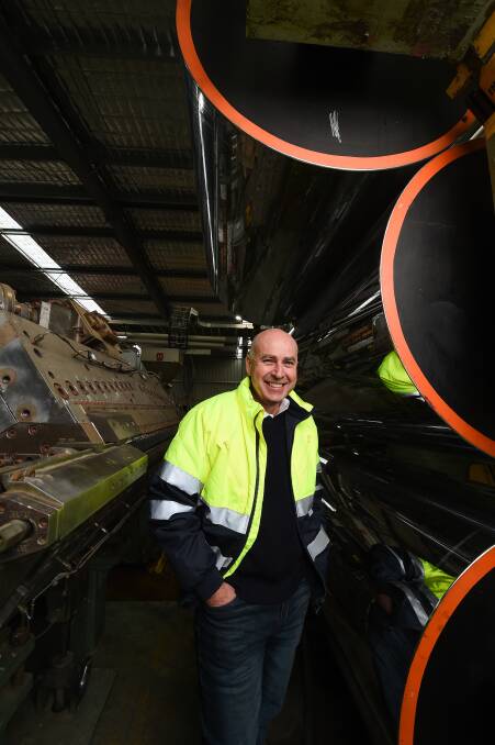 SOLUTION: Plastic Forests was the first globally to dry-clean plastic film. It is processed through machines, including this extruder co-funded by NSW EPA, and goes into new products. Pictures: MARK JESSER