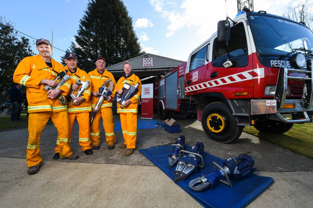NEW GEAR: Mount Beauty Fire Brigade members Richard Stratton, Mike Parkinson, Russell Bowring and Rob Boland, with new rescue tools from CFA. Picture: MARK JESSER