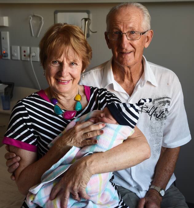 ECSTATIC: Grandparents Joan Canning and Lance Canning spend Christmas with the newest addition of the family.