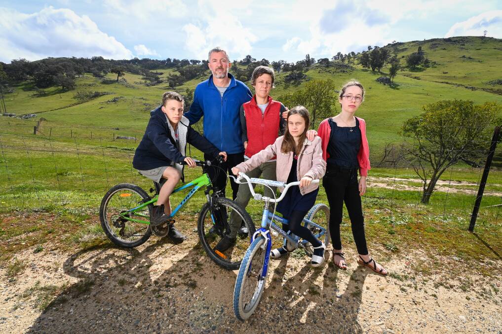 GOOD CALL: Matt and Rachel King are glad their children, James, 11, April, 9, and Jasmine, 13, can return to school from Friday, but they're worried about those outside the 50km. Picture: MARK JESSER