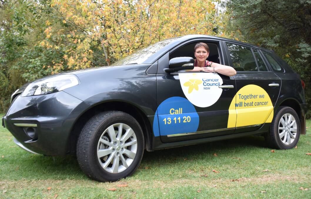 NEW WHEELS: Relay for Life committee member Caroline Sale picks up the car for cancer patients for Cancer Council NSW. Picture: Ellen Ebsary 