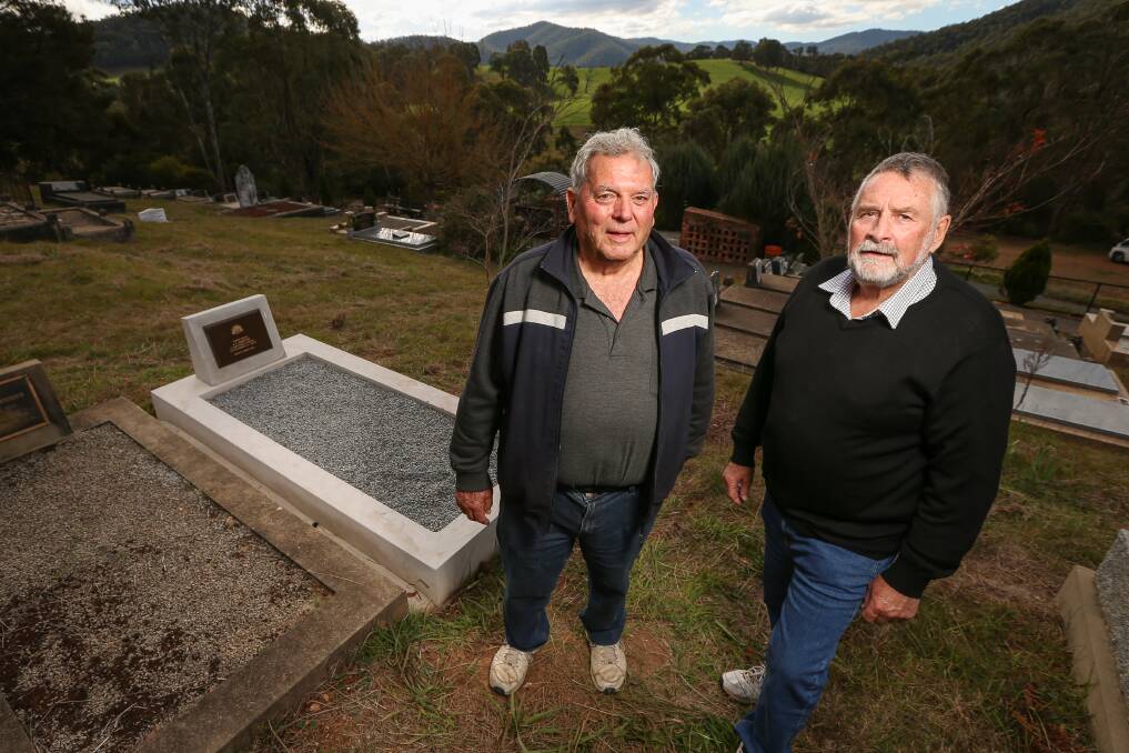 ACHIEVEMENT: Damian Ley and Terry Smith of the Kiewa RSL Sub-branch at the grave of James Hawton in the Mitta Cemetery, which has finally been marked and made a war grave. Picture: JAMES WILTSIRE