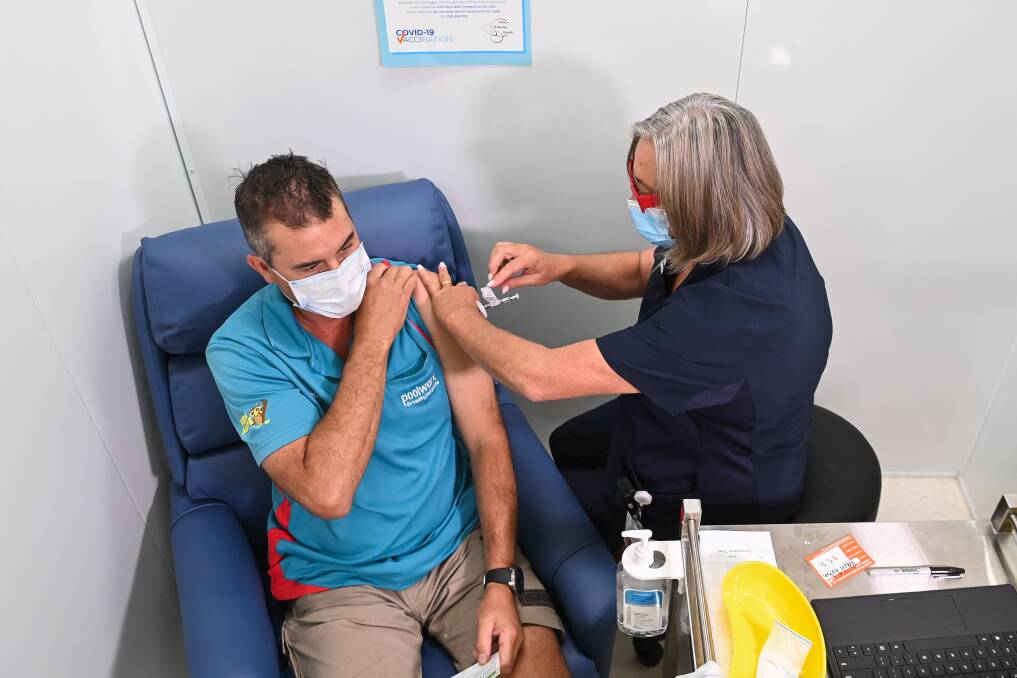Wodonga's Rob Hudson gets the COVID-19 vaccination at the Albury Wodonga Health vaccination hub on High Street. Picture: MARK JESSER