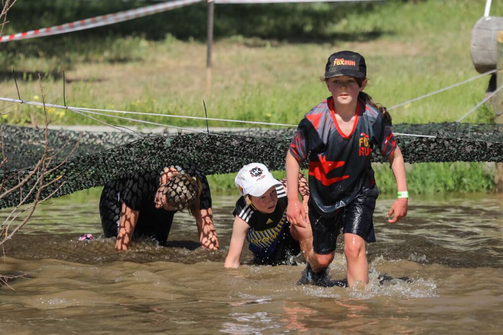 Racers get muddy during the 2017 fox run, which raised $20,000 for the Milawa and Oxley primary schools. Picture: MARC BONGERS