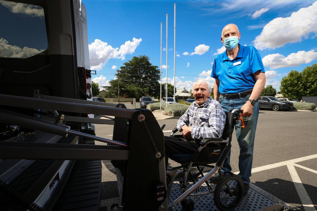 NEW RIDE: Aged care residents at the Culcairn Multipurpose Service like Henry Knust can now take part in outings around the district, after LHAC members including David Gilmore facilitated a new bus. Picture: JAMES WILTSHIRE
