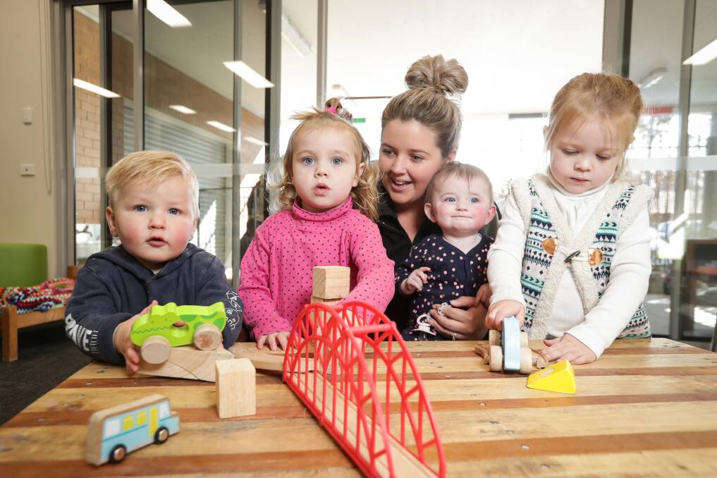 FRESH FACE: Maverick Wayenberg, 1, Ruby McWaters, 2, Steph Tacey, Izzy Thompson, 6 months, and Ivy McWaters, 4, at the launch of Greater Hume Children Services' re-branding in Jindera on Thursday. Picture: JAMES WILTSHIRE