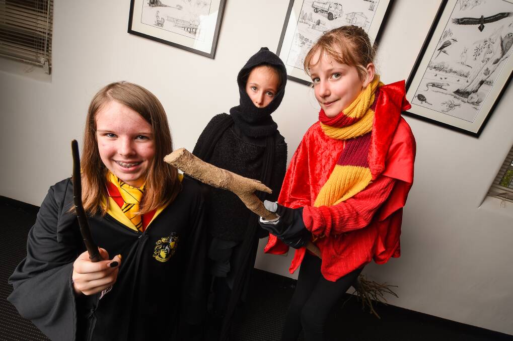 A BIT OF MAGIC: Emlyn Connor, 12, Imogen Rocchiccioli, 7, and Clara Rocchiccioli, 10, took part in Harry Potter night. Picture: MARK JESSER