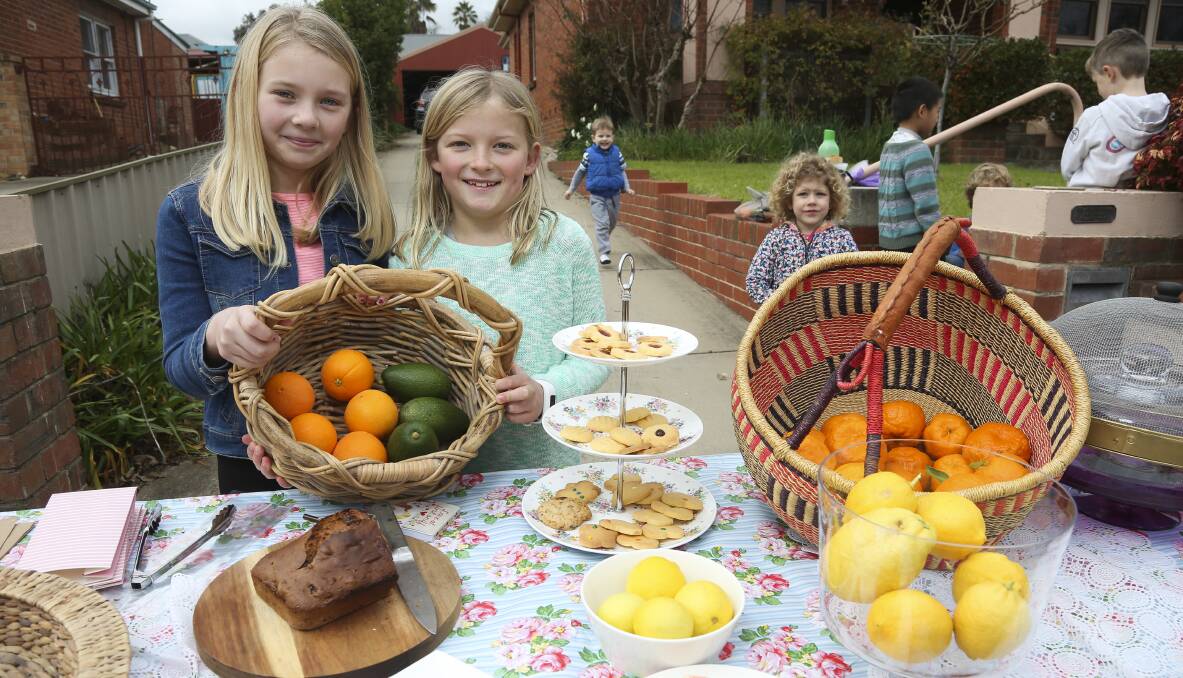 BUSY BAKERS: Friends Matilda Thompson, 9, and Amelie Cameron, 10, held a stall offering home-baked goods in East Albury and raised more than $250 for the new cancer centre. Pictures: ELENOR TEDENBORG