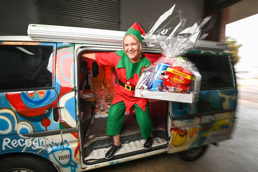 Carevan elf (project officer Leanne Johnson) is getting ready to deliver hampers to those in need this Christmas. Picture: MARK JESSER