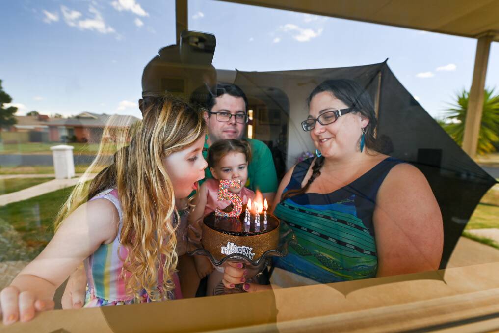 STUCK INSIDE: The Kilday family - Corissa and Clint and their daughters Zoe, 2, Sophia 5 - are having to quarantine for 14 days despite testing negative to COVID-19 and being in no areas of concern. New transit permits don't require 14 days' isolation. Picture: MARK JESSER