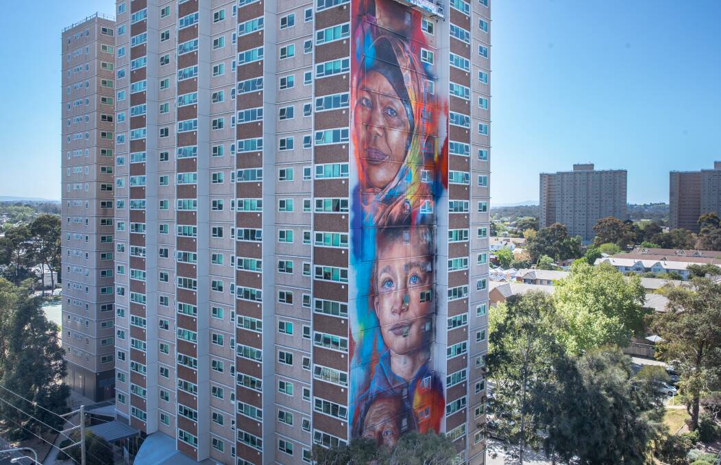 RECORD: The tallest mural in the Southern Hemisphere on a social housing block in Collingwood, made possible by Juddy Roller and artist Matt Adnate. Picture: FAIRFAX