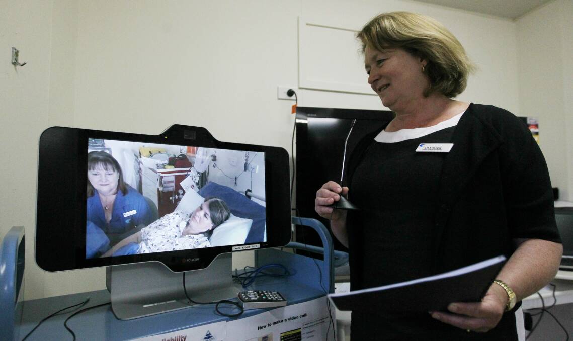 TECH TALK: Tallangatta Health Service director of nursing Lisa Allen links to nurse manager Margaret Winter and her patient. Tallangatta and Corryong can now connect via Telehealth to Albury Wodonga Health. Picture: ELLEN EBSARY