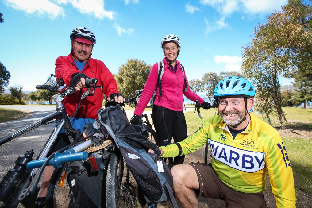 JOURNEY: Harry Beehre and Rhonda Redgment get some tips off Ken Every during a training ride for the Great Victorian Bike Ride. They will cycle from Wilsons Promontory to Gippsland later this year. Picture: JAMES WILTSHIRE